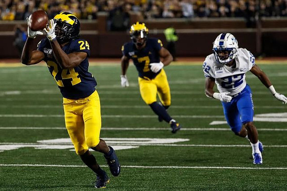 Zach Charbonnet (24) and Tarik Black (7)