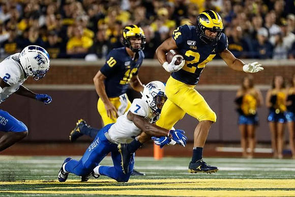 Dylan McCaffrey (10) and Zach Charbonnet (24)