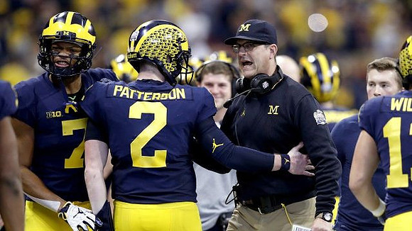 Tarik Black (7), Shea Patterson (2), and Jim Harbaugh