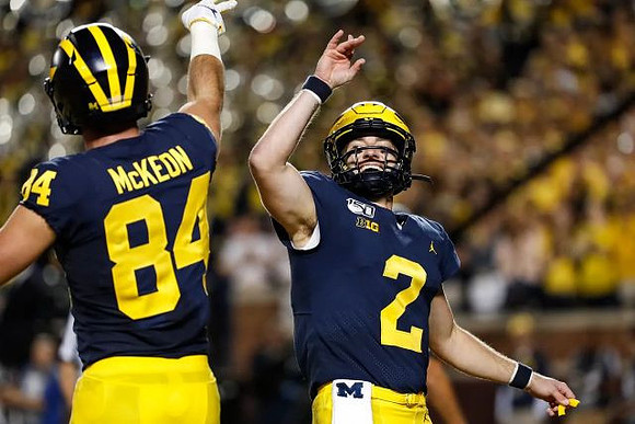 Sean McKeon (84) and Shea Patterson (2)