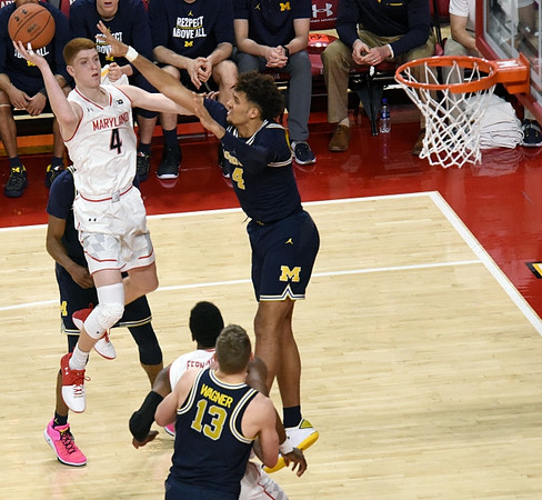 Isaiah Livers (4) and Moritz Wagner (13)