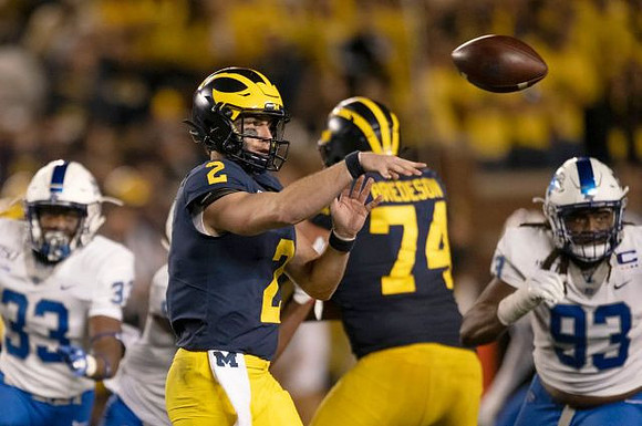 Shea Patterson (2) and Ben Bredeson (74)