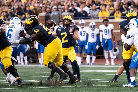 Michael Onwenu (50) and Shea Patterson (2)