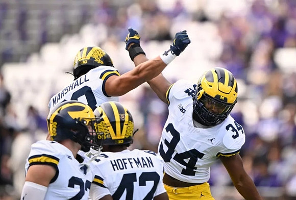 Zack Marshall (83), Jalen Hoffman (42), and Leon Franklin (34)