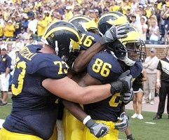 Mario Manningham, Alex Mitchell, and Adrian Arrington