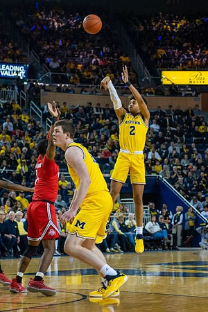 Jon Teske (15) and Jordan Poole (2)