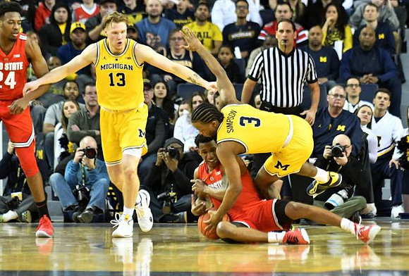 Ignas Brazdeikis (13) and Zavier Simpson (3)