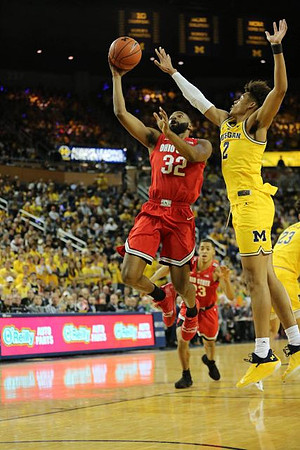 Jordan Poole (2) and Brandon Johns Jr. (23)
