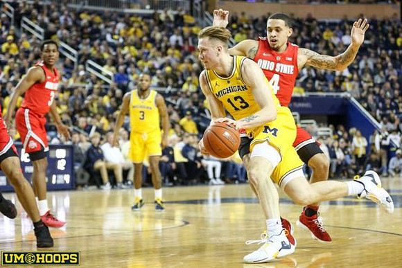 Zavier Simpson (3) and Ignas Brazdeikis (13)