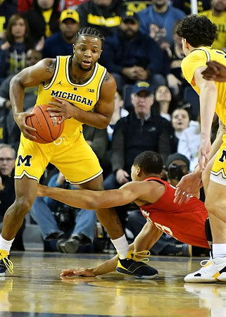 Zavier Simpson (3) and Brandon Johns Jr. (23)