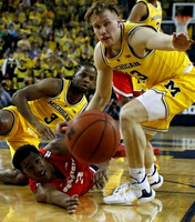 Zavier Simpson (3) and Ignas Brazdeikis (13)