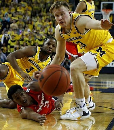 Zavier Simpson (3) and Ignas Brazdeikis (13)