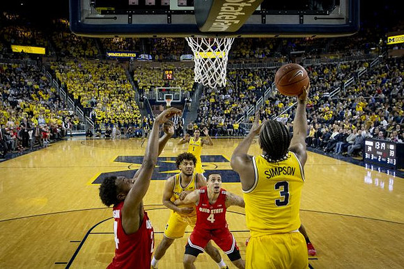 Zavier Simpson (3), Isaiah Livers (4), and Charles Matthews (1)