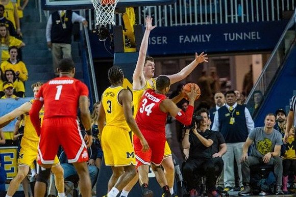 Ignas Brazdeikis (13), Zavier Simpson (3), and Jon Teske (15)
