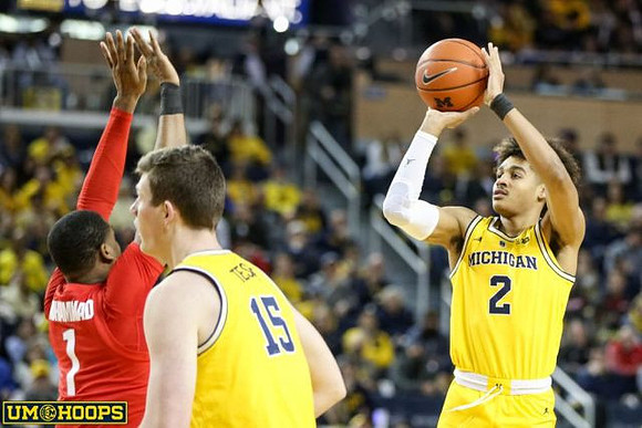 Jon Teske (15) and Jordan Poole (2)