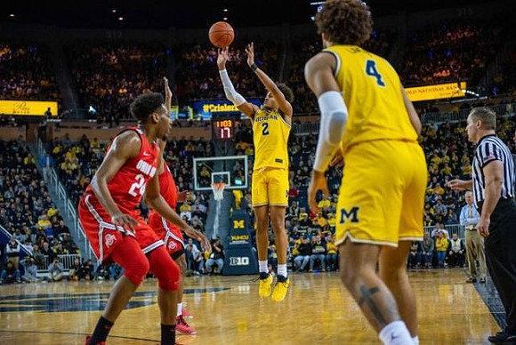 Jordan Poole (2) and Isaiah Livers (4)