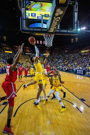 Jordan Poole (2), Ignas Brazdeikis (13), Charles Matthews (1), and Zavier Simpson (3)
