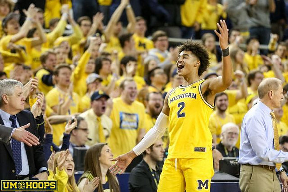 Zavier Simpson (3) and John Beilein