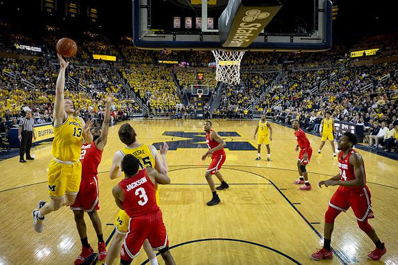 Ignas Brazdeikis (13), Jon Teske (15), Zavier Simpson (3), and Jordan Poole (2)