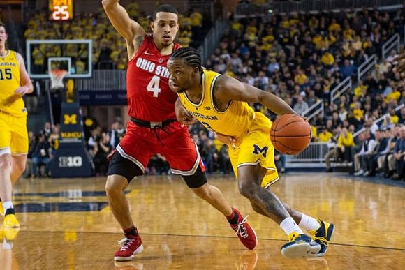 Jon Teske (15) and Zavier Simpson (3)