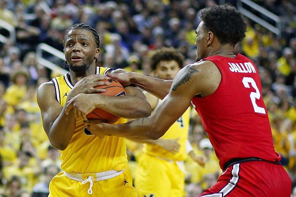 Zavier Simpson (3) and Isaiah Livers (4)