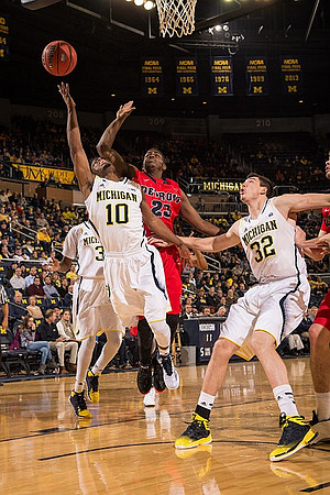 Derrick Walton Jr. (10) and Ricky Doyle (32)