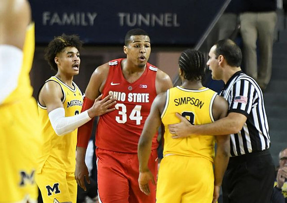 Jordan Poole (2) and Zavier Simpson (3)