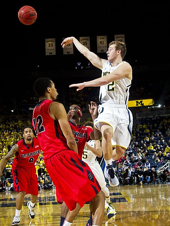 Spike Albrecht (2) and D.J. Wilson (5)