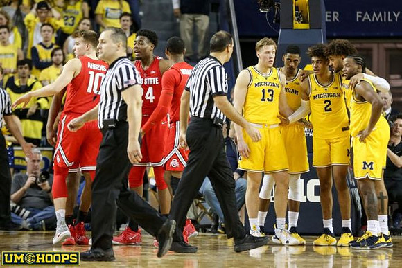 Ignas Brazdeikis (13), Charles Matthews (1), Jordan Poole (2), Isaiah Livers (4), and Zavier Simpson (3)