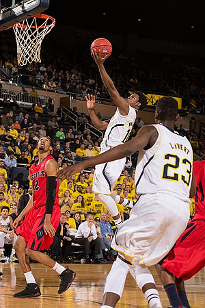 Derrick Walton Jr. (10) and Caris LeVert (23)