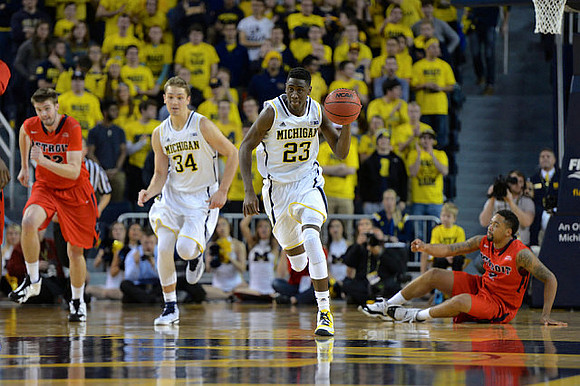 Mark Donnal (34) and Caris LeVert (23)