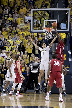 D.J. Wilson (5) and Zak Irvin (21)