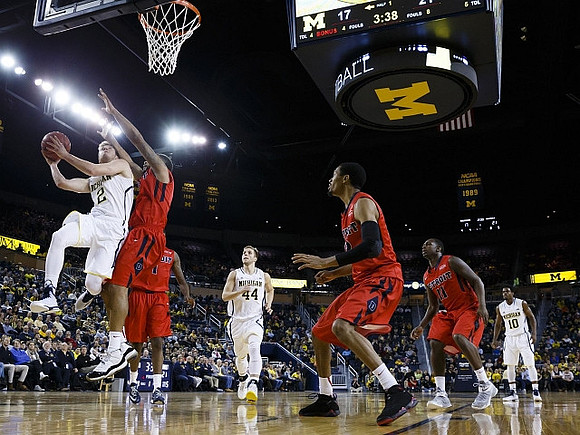 Spike Albrecht (2), Max Bielfeldt (44), and Derrick Walton Jr. (10)