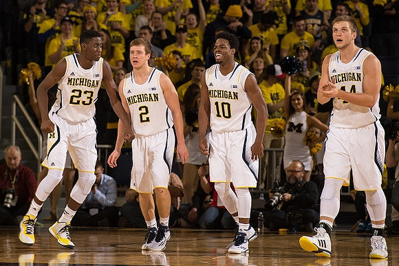 Caris LeVert (23), Spike Albrecht (2), Derrick Walton Jr. (10), and Max Bielfeldt (44)
