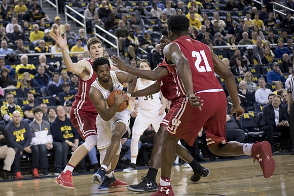 Derrick Walton Jr. (10) and Mark Donnal (34)