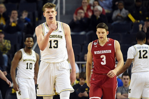 Derrick Walton Jr. (10), Moritz Wagner (13), and Muhammad-Ali Abdur-Rahkman (12)