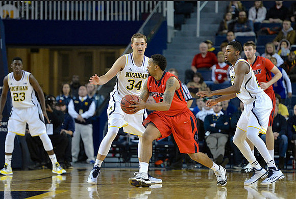 Caris LeVert (23), Mark Donnal (34), and Zak Irvin (21)