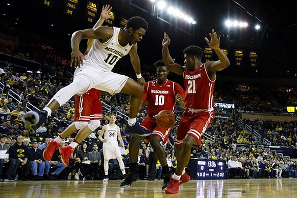 Derrick Walton Jr. (10) and Mark Donnal (34)