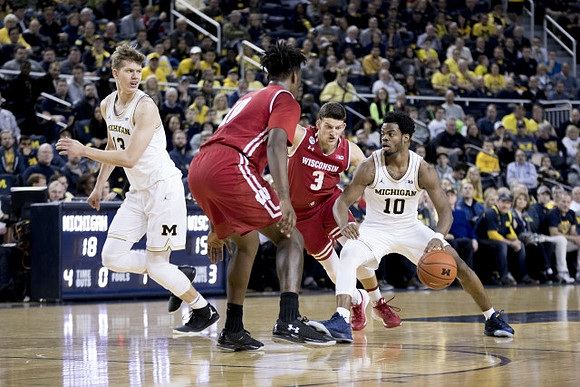 Moritz Wagner (13) and Derrick Walton Jr. (10)