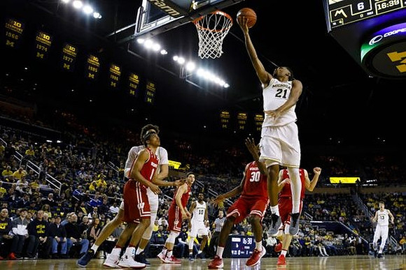 D.J. Wilson (5), Zak Irvin (21), Derrick Walton Jr. (10), and Moritz Wagner (13)