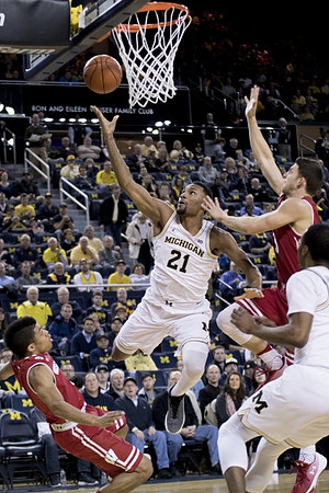 Zak Irvin (21) and Muhammad-Ali Abdur-Rahkman (12)