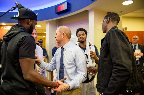 Tim Hardaway Jr., John Beilein, Billy Donlon, Derrick Walton Jr. (10), and Caris LeVert