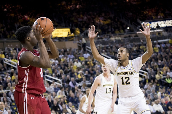 Muhammad-Ali Abdur-Rahkman (12), Moritz Wagner (13), and Zak Irvin (21)