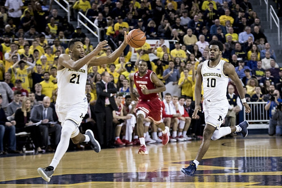 Zak Irvin (21) and Derrick Walton Jr. (10)