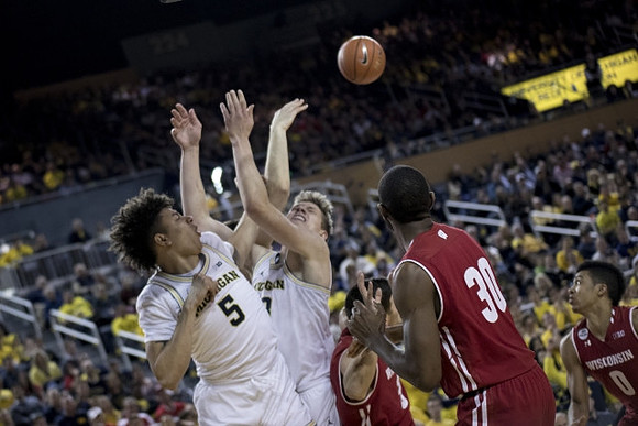 D.J. Wilson (5) and Moritz Wagner (13)