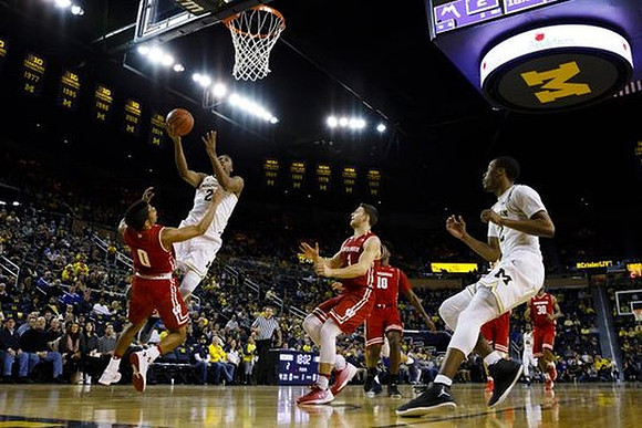 Muhammad-Ali Abdur-Rahkman (12) and Zak Irvin (21)