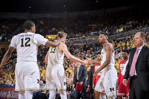 Muhammad-Ali Abdur-Rahkman (12), Moritz Wagner (13), Zak Irvin (21), and Wisconsin Badgers Head Coach Greg Gard
