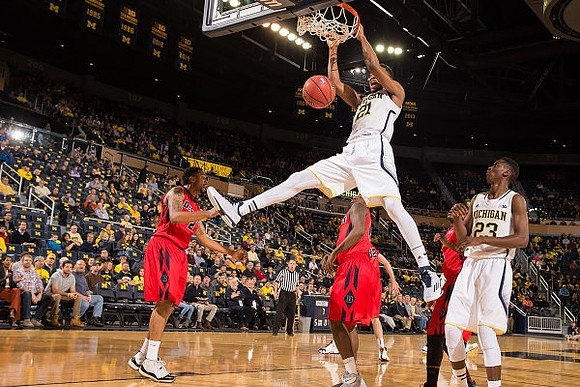 Zak Irvin (21) and Caris LeVert (23)