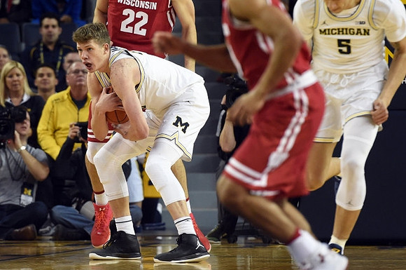 Moritz Wagner (13) and D.J. Wilson (5)