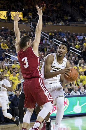Muhammad-Ali Abdur-Rahkman (12) and Zak Irvin (21)